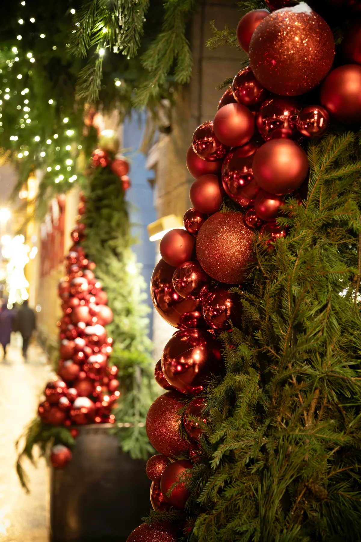 Red christmas ornaments on evergreen branches - Free Photo on Unsplash