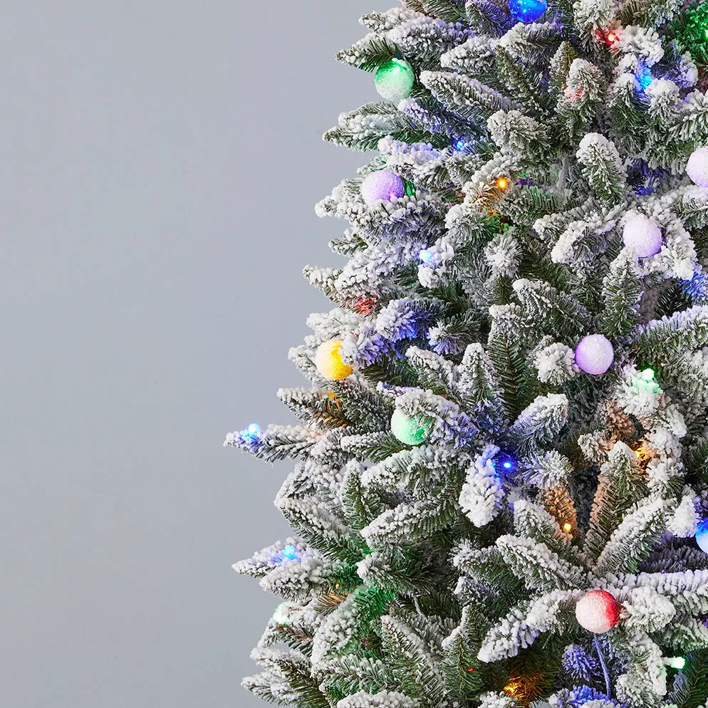 Snow Kissed Slim Flocked Pine Pre-Lit Tree with Multicolor LED Lights 7 ft