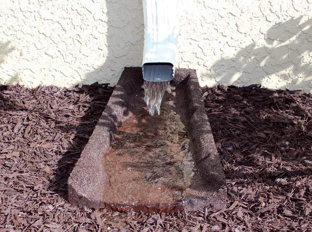 Spring rains – the importance of using a splash block! - Ground Smart Rubber Mulch
