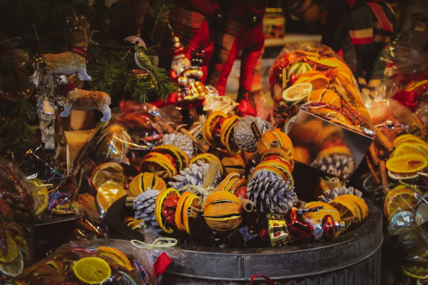 Vibrant Christmas market scene with festive decorations and dried orange slices.