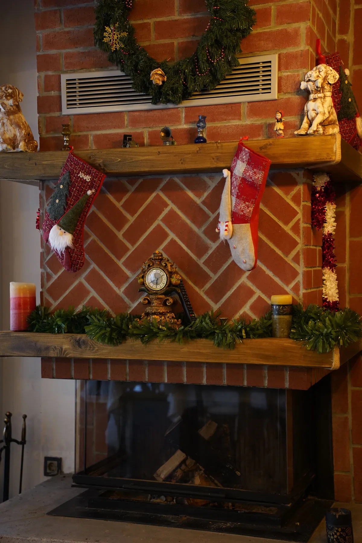 Warm and inviting fireplace with festive Christmas decorations and seasonal ambiance.